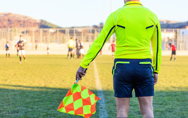 Football assistant referee in action