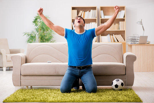 Man Watching Football At Home