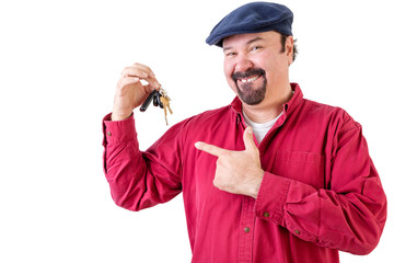 Proud man pointing to his new car keys