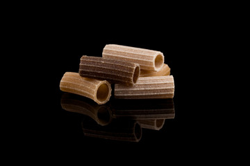 Close-up of pasta over black background