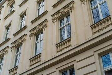 detailed view of orange facade with beautiful windows