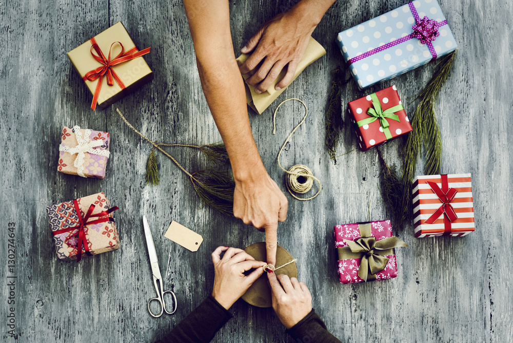 Poster young woman and man wrapping gifts