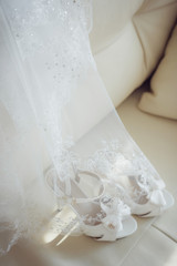 Obraz na płótnie Canvas white shoes and wedding dress background