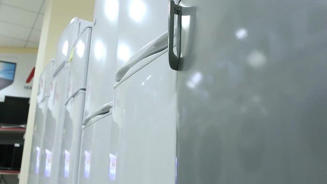 Rows of modern fridges in a store