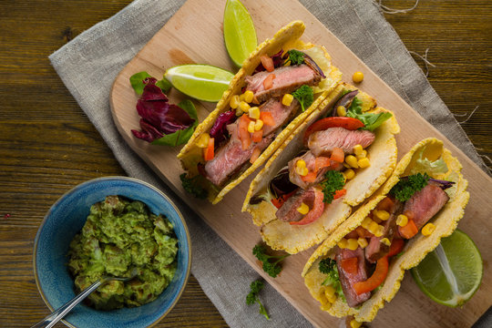 Tacos with beef, pepper and guacamole