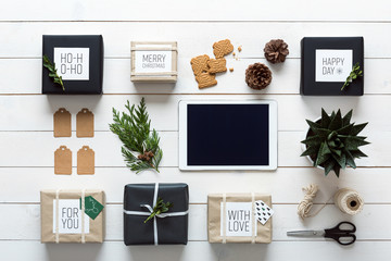 Elegant nordic retro christmas, wrapping station, desk view from above, online shopping concept