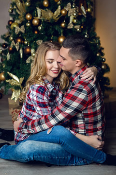 young couple boy and girl in checkered shirts
