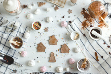 Ginger biscuits cooked at home on a white wood table with different sweets. top view