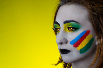 Sensual girl with colorful bodyart and face art       