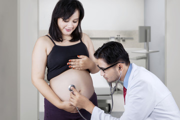 Expectant woman visiting an obstetrician