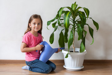 Little Girl And Blue Watering Can