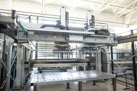 The automatic plasma robot in the course of metal cutting. Modern production of metal details. Industrial cnc plasma machine cutting of metal plate