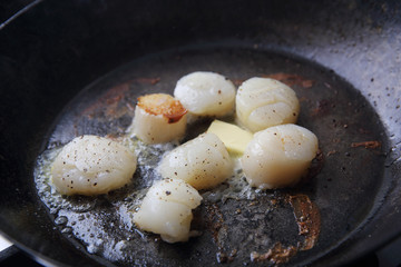 Scallops fried in pan