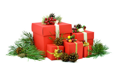 Christmas gifts in red boxes. Pine branches with cones. Isolatio