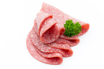 Salami smoked sausages slices isolated on white background.