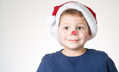 lovely adorable kid with paintings on his face for Christmas