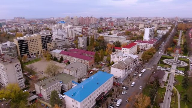 Aerial view of the russian southern city - Krasnodar. A pedestrian path. City park. Triumphal arch. King's gate. 4K