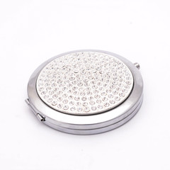 pocket mirror with diamonds isolated on white