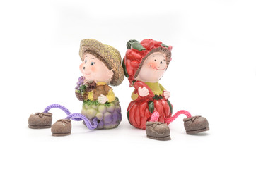 figurine boy and girl with a rope legs isolated on white