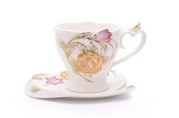 mug with flowers and saucer isolated on white