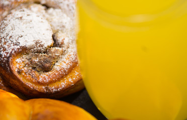 Closeup freshly baked cinnabon with powdered sugar coating, as seen from above, pastry concept