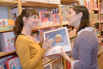 attractive customer and seller at the toy store
