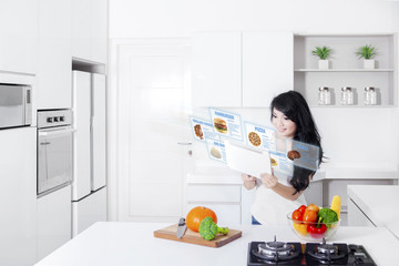 Woman and digital tablet with virtual recipes