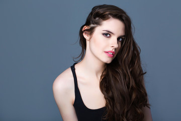 Fototapeta premium Beautiful woman with healthy skin and healthy hair looking at the camera.