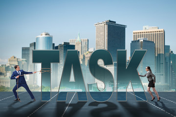 Obraz premium Businesswoman and businessman in task concept