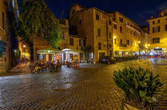 Night view of old cozy square in Trastevere in Rome, Italy