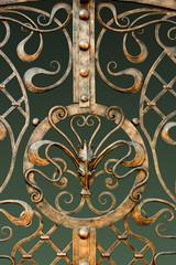 Fragment of baroque metal gate , gold leaf, manual work  blacksmith.
