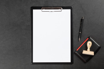 Black clipboard on a table