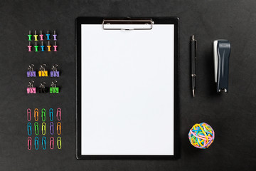Black clipboard on a table