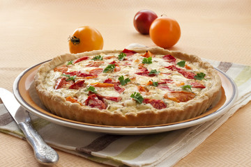 Tart with salted sheep cheese and tomatoes
