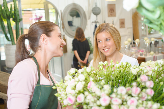 Florist interacting with customer
