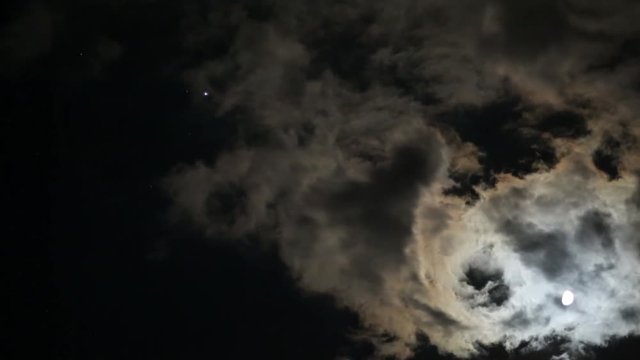 Full moon timelapse with clouds passing by