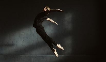 Skillful flexible dancer performing in the air