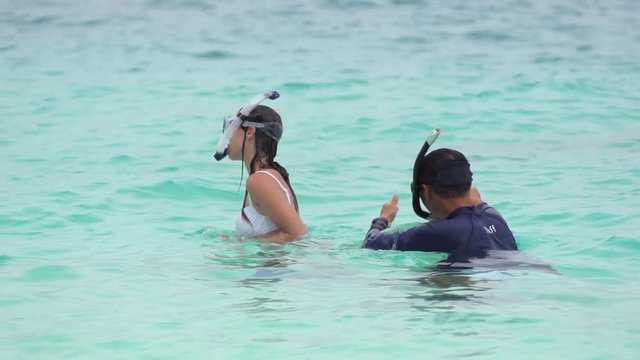 Young Woman And Diving Instructor Begin The Course