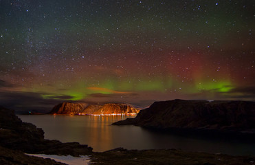 Fototapeta na wymiar Arctic winter nights with northern lights and stars
