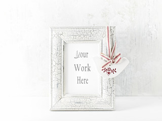 Shabby chic image frame with a vintage decoration