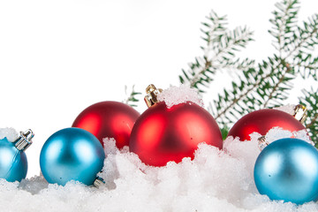 Naklejka na ściany i meble Christmas decorations in the snow on a white background