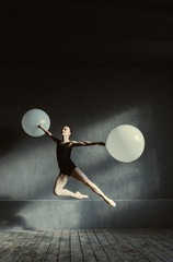 Proficient ballet dancer performing difficult dancing pa