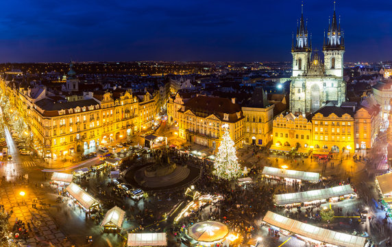 View from above on traditional Christmas market at Old Town Square illuminated and decorated for holidays in Prague, capital of Czech Republic.