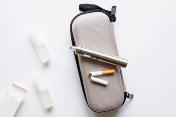 concept of electronic cigarette on white background top view