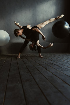 Flexible ballet dancers performing in the close interaction