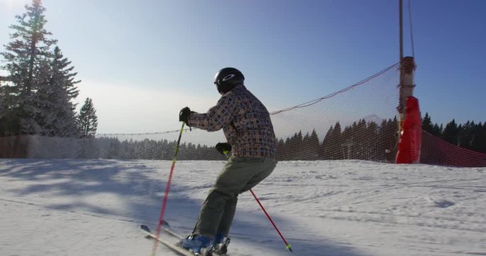 Beautiful Sun Flared Slow Motion  Of Skier Training Balance While Skiing 