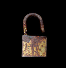 Old lock key isolated on black background