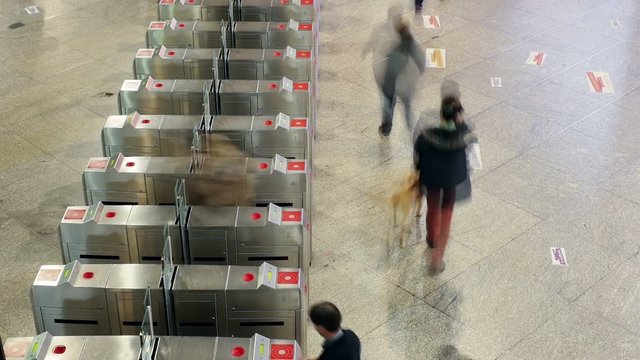 People In Underground Subway Going Through Turnstile Timelapse From Above