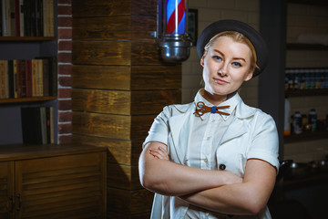 Fashion woman barber hairstylist in the barbershop