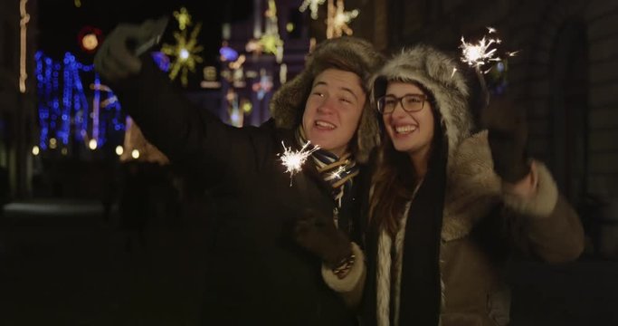 Friends Taking Selfie With Christmas Sparks